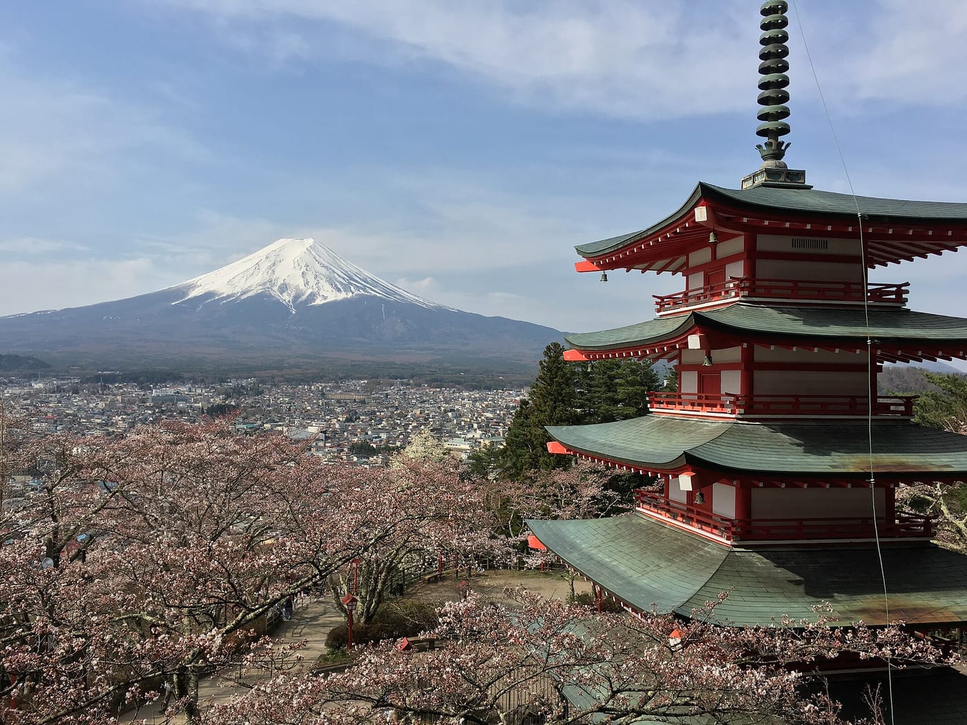 Mount Fuji seen beyond the Chūreitō Pagoda with cherry blossoms