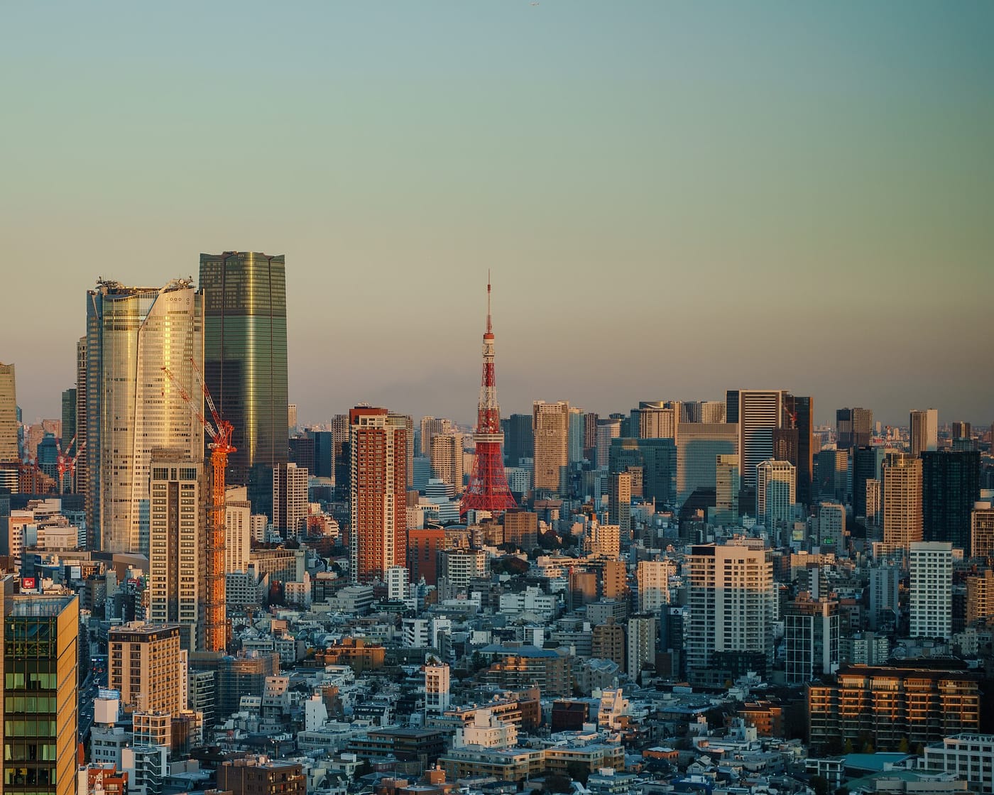 The Tokyo skyline at golden hour with Tokyo Tower at its center